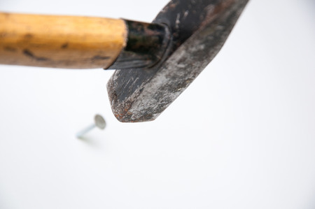 Studio isolated hammer hitting a nailの写真素材