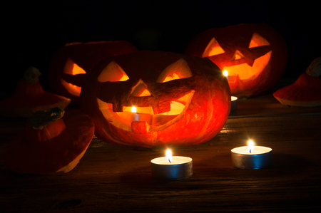 Scary halloween pumpkins on dark backgroundの写真素材