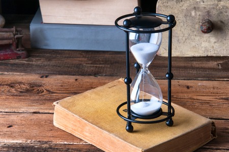 Hourglass in old library