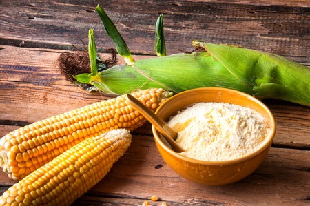 Fresh corn and corn flour. Top view
