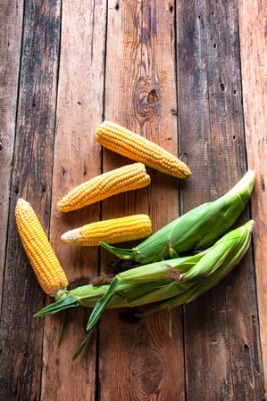 Fresh corn on wooden background. Top view. Copyspaceの写真素材