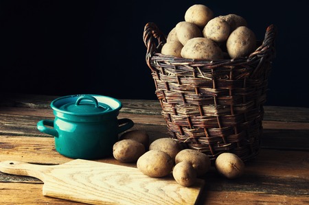 Potatoes in old rustic kitchenの写真素材