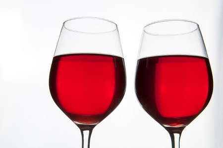 Two glasses of red wine isolatedの写真素材