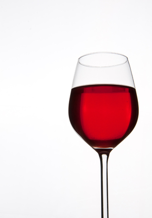 Glass of red wine isolated. Copyspaceの写真素材
