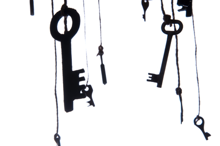 Many rustic keys hanging on string. Selective focus. Isolatedの写真素材