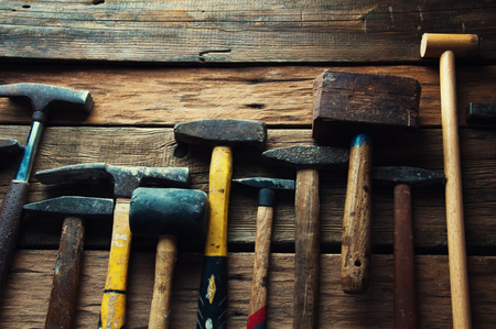 Many old hammers in carpenter's workshopの写真素材