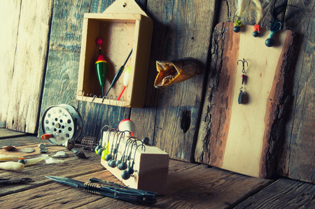 Fishing equipment on vintage wooden backgroundの写真素材