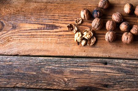 Walnuts on wooden background. Copyspaceの写真素材