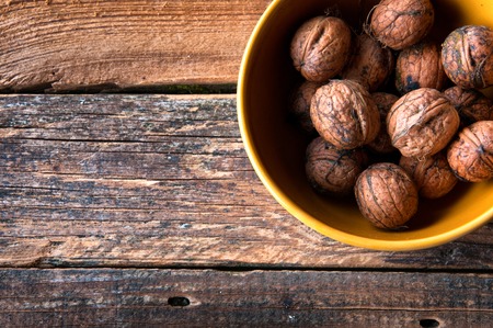 Walnuts on wooden background. Copyspaceの写真素材