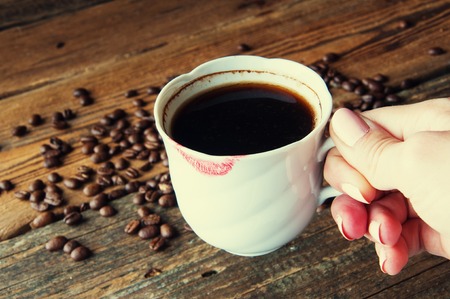 Red lipstick on a cup of coffee. Copyspaceの写真素材