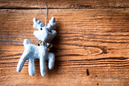 Christmas tree decoration reindeer on wooden background. Copyspaceの写真素材