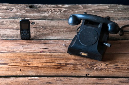 Comparison of old landline telephone to a mobile phone