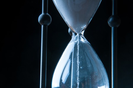 Hourglass on dark background