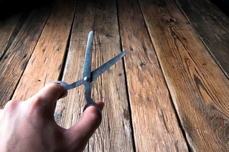 Hand holding scissors. Copyspaceの写真素材