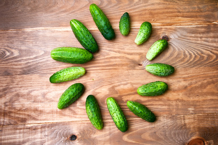 Mini cucumbers on tableの写真素材