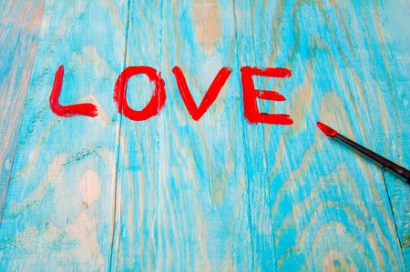 Word Love painted on wooden tableの写真素材