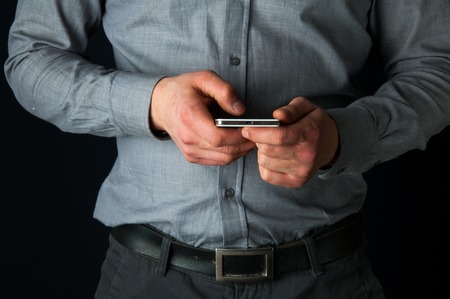 Businessman checking his cellphone