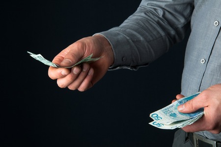 Business person paying cashの写真素材