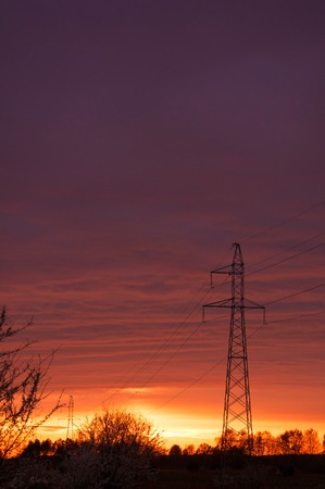 Sunset over high voltage pole