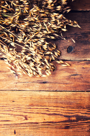 Oat on wooden background, copyspaceの写真素材