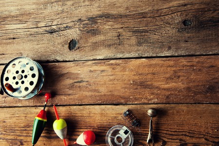 Fishing lures on wooden background. Copyspaceの写真素材