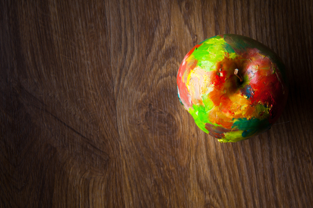 Oil painted apple on wooden background. Abstract. Copyspaceの写真素材