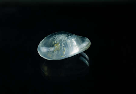 An almost water-clear rock crystal with beautiful inclusions.の写真素材