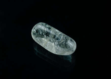 An almost water-clear rock crystal with beautiful inclusions.の写真素材