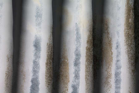 Texture of old weathered corrugated iron. You can see the age on the surface.の写真素材