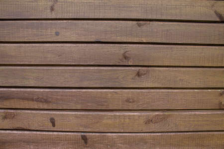 Texture of an old brown wooden wall. The slats are installed vertically.の写真素材