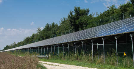 An outdoor photovoltaic system that was built in length on a highway.の写真素材
