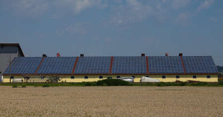 A very large photovoltaic system on an agricultural building. With six large units.の写真素材