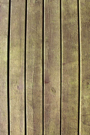 Texture of an old brown wooden wall. The slats are installed vertically.の写真素材
