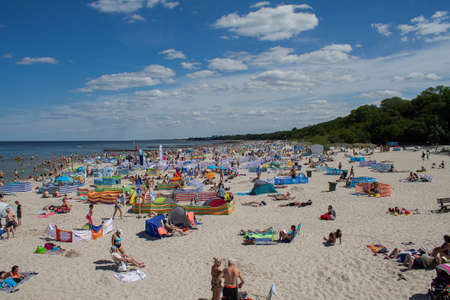 People on the Polish Baltic Sea beach here in Kolobrzeg, Kolberg Summer 2020.のeditorial素材