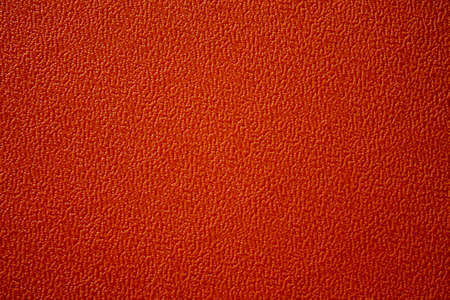 Texture of an orange plastic plate. The plate has an interesting pattern.の写真素材