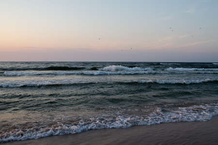 The waves break on the beach. Taken here at the Baltic Sea.の写真素材