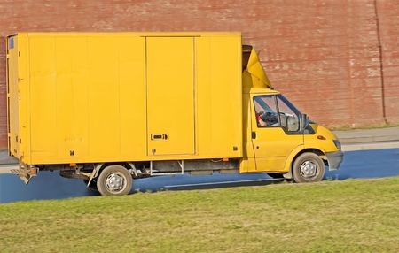 tractor trailer truck on background of trees of 