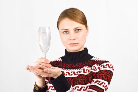 young woman with a full glass の写真素材