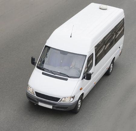 mini small passenger Tour van bus on road isolatedの写真素材