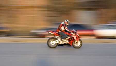  bike rider on motorcycle speed on a highway