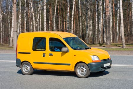 yellow van on roadの写真素材