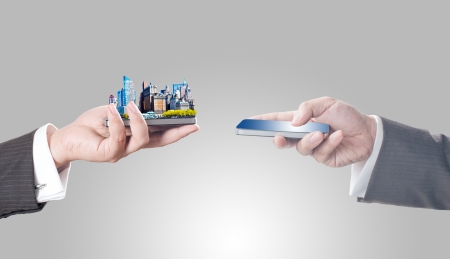 Business men holding smart phone with city on screen for business trading concept Business men holding smart phone with city on screen for business trading concept