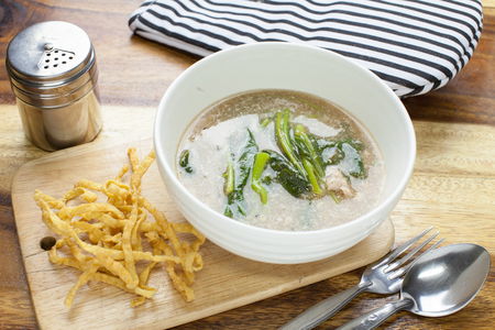 Fried noodle in Gravy on wooden backgroundの写真素材