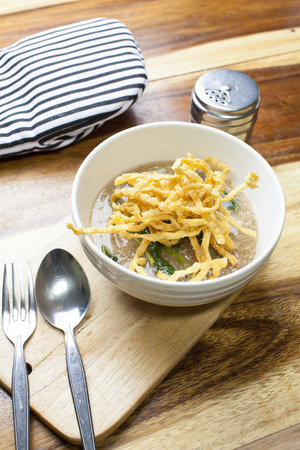 Fried noodle in Gravy on wooden backgroundの写真素材