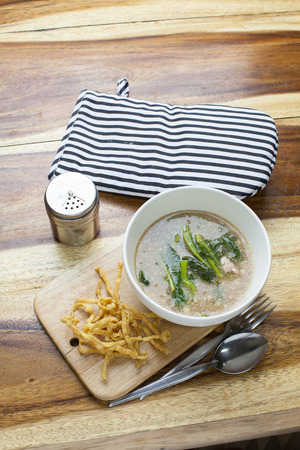 Fried noodle in Gravy on wooden backgroundの写真素材