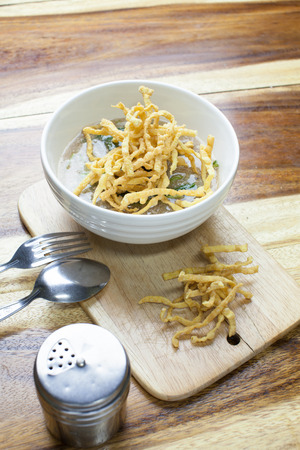Fried noodle in Gravy on wooden backgroundの写真素材