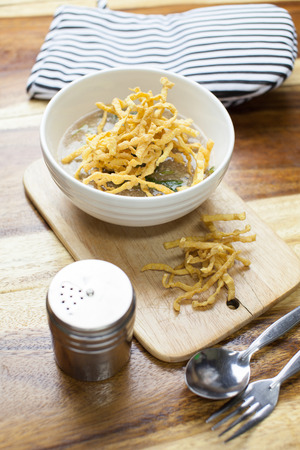 Fried noodle in Gravy on wooden backgroundの写真素材