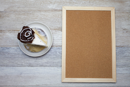 Brownie cheese cake and cork board background