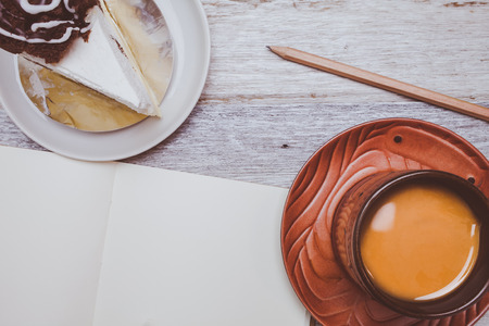 Brownie cheese cake,and coffee on wooden background.の写真素材