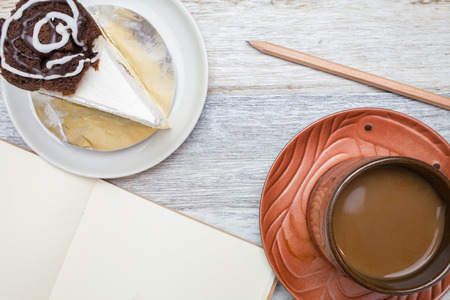 Brownie cheese cake,and coffee on wooden background.の写真素材
